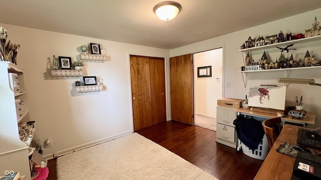 202 Collier St, Columbus, IN 47201 - home office featuring dark wood-style flooring and baseboards