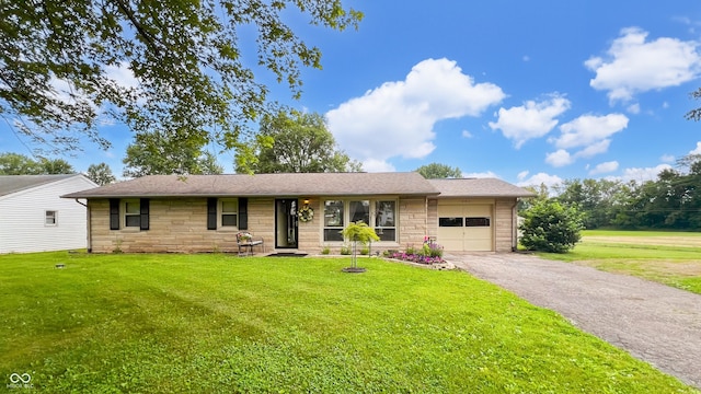 202 Collier St, Columbus, IN 47201 - ranch-style house with stone siding, a garage, driveway, and a front lawn