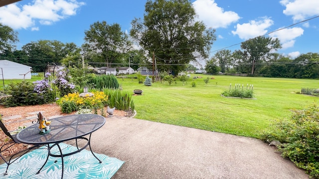 202 Collier St, Columbus, IN 47201 - view of grassy yard featuring a patio and view of scattered trees