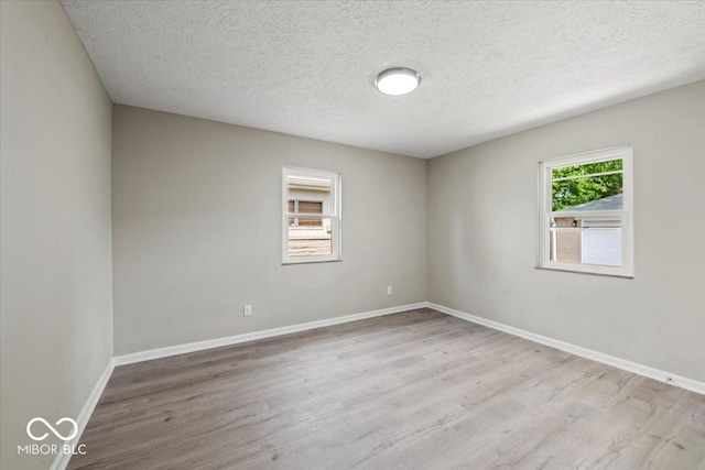 508 W 38th St, Indianapolis, IN 46208 - unfurnished room featuring wood finished floors and a textured ceiling