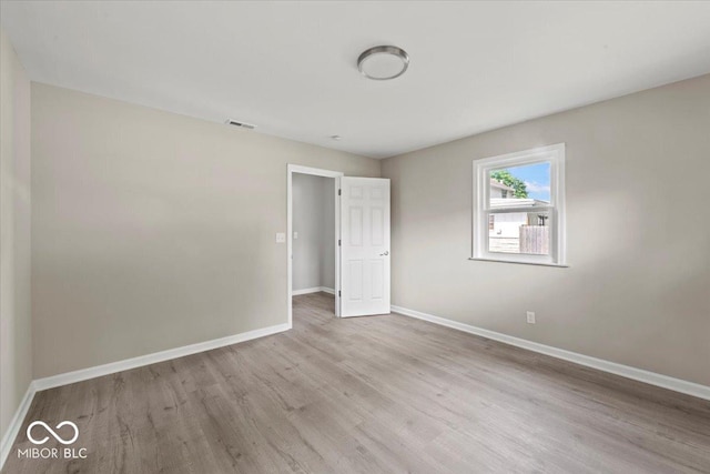508 W 38th St, Indianapolis, IN 46208 - spare room featuring wood finished floors and baseboards