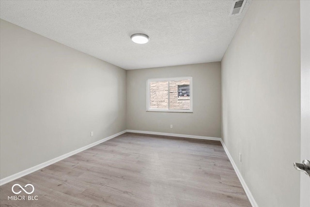 508 W 38th St, Indianapolis, IN 46208 - unfurnished room featuring wood finished floors and a textured ceiling