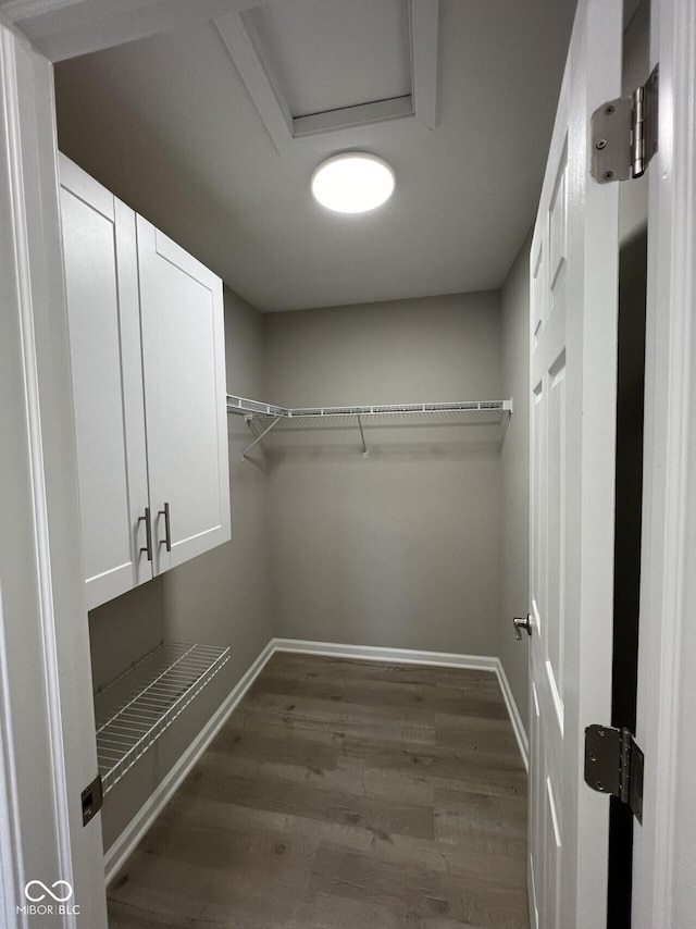 508 W 38th St, Indianapolis, IN 46208 - walk in closet with dark wood-style flooring and attic access
