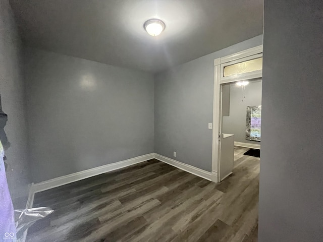 3127 E Lynn St, Anderson, IN 46016 - unfurnished room with dark wood-type flooring and baseboards