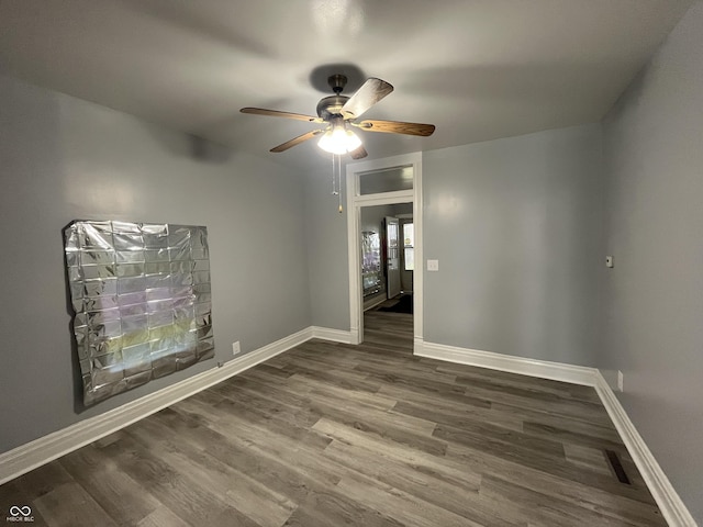 3127 E Lynn St, Anderson, IN 46016 - empty room with a ceiling fan and wood finished floors