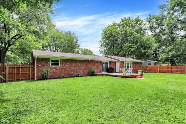 4132 Tincher Rd, Indianapolis, IN 46221 - rear view of property with a wooden deck, a fenced backyard, and brick siding