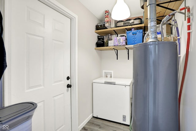4132 Tincher Rd, Indianapolis, IN 46221 - laundry area with light wood finished floors, washer hookup, and water heater