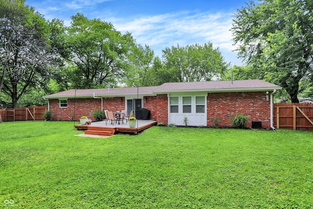 4132 Tincher Rd, Indianapolis, IN 46221 - back of house featuring a wooden deck, a fenced backyard, and brick siding