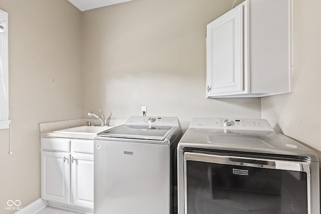 11266 Old Stone Dr, Indianapolis, IN 46236 - washroom with cabinet space and washer and clothes dryer