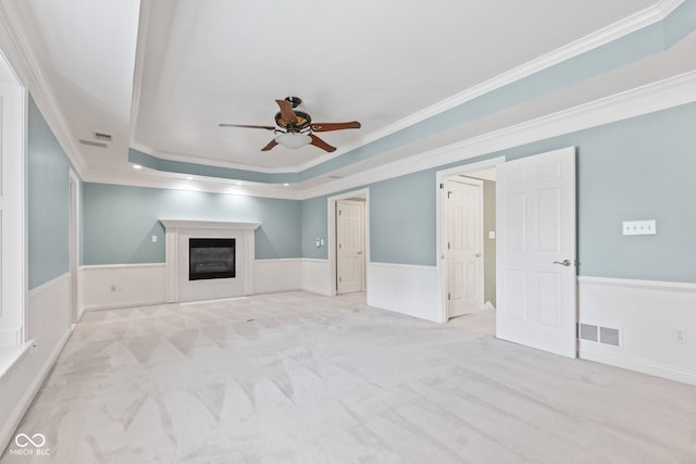 11266 Old Stone Dr, Indianapolis, IN 46236 - unfurnished living room with ceiling fan, carpet, crown molding, a glass covered fireplace, and a wainscoted wall