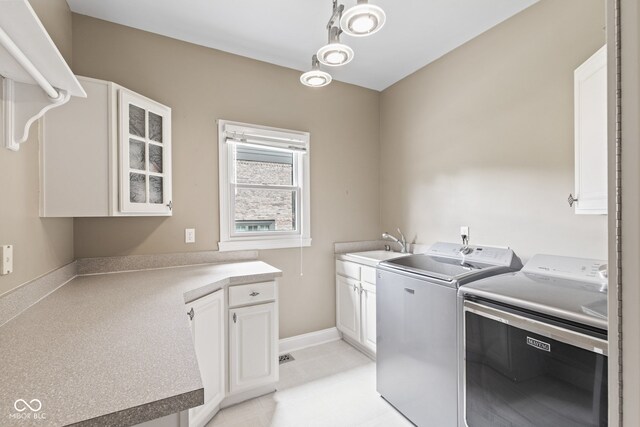 11266 Old Stone Dr, Indianapolis, IN 46236 - laundry room featuring independent washer and dryer and cabinet space