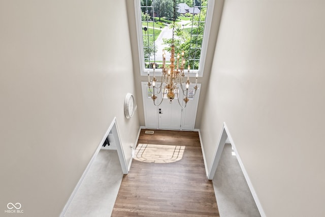 11266 Old Stone Dr, Indianapolis, IN 46236 - entryway with wood finished floors, a chandelier, and a high ceiling