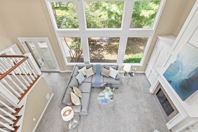 11266 Old Stone Dr, Indianapolis, IN 46236 - unfurnished living room featuring healthy amount of natural light, carpet floors, and a towering ceiling