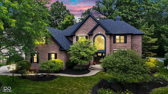 11266 Old Stone Dr, Indianapolis, IN 46236 - traditional-style home with brick siding, a chimney, and roof with shingles