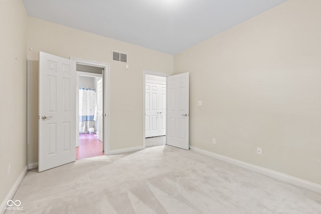 11266 Old Stone Dr, Indianapolis, IN 46236 - unfurnished bedroom featuring light colored carpet and ensuite bath