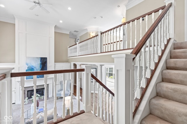 11266 Old Stone Dr, Indianapolis, IN 46236 - stairs with crown molding, ceiling fan, recessed lighting, a high end fireplace, and a decorative wall