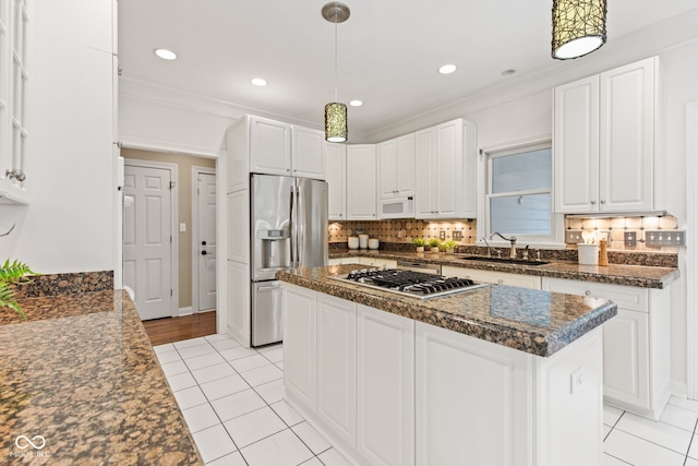 11266 Old Stone Dr, Indianapolis, IN 46236 - kitchen with stainless steel appliances, dark countertops, light tile patterned floors, white cabinetry, and crown molding