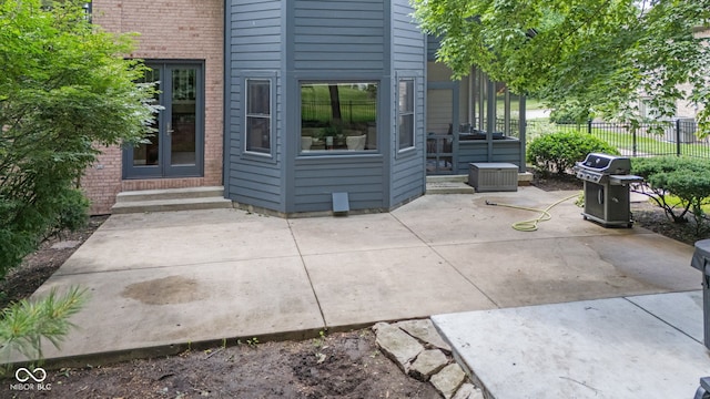 11266 Old Stone Dr, Indianapolis, IN 46236 - doorway to property with brick siding and a patio area