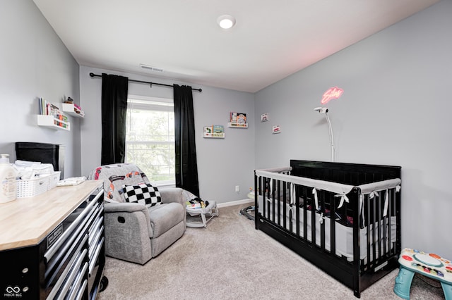6332 Card Blvd, Indianapolis, IN 46221 - carpeted bedroom featuring baseboards and a nursery area