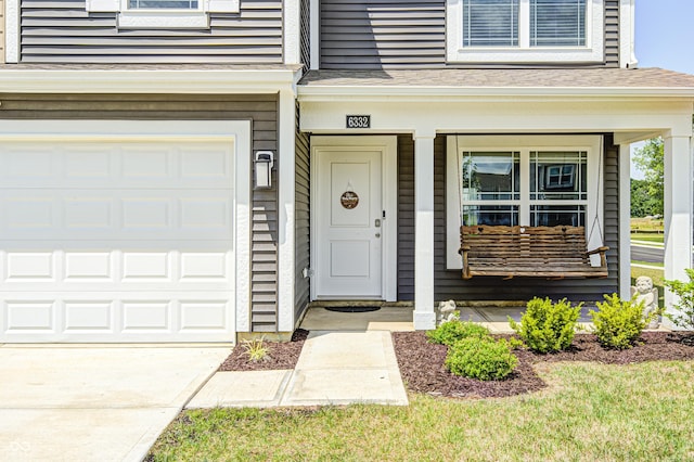 6332 Card Blvd, Indianapolis, IN 46221 - view of exterior entry with a porch and a garage