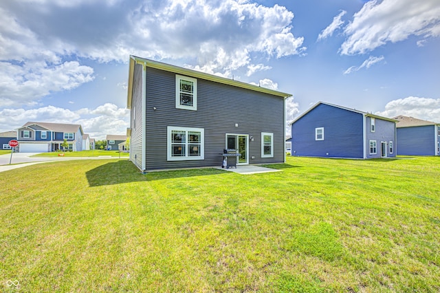 6332 Card Blvd, Indianapolis, IN 46221 - back of house featuring a lawn and a patio