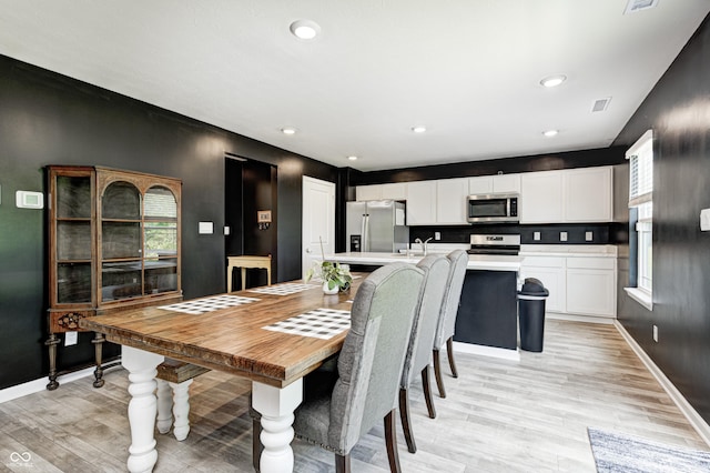 6332 Card Blvd, Indianapolis, IN 46221 - dining room with light wood-style floors and recessed lighting