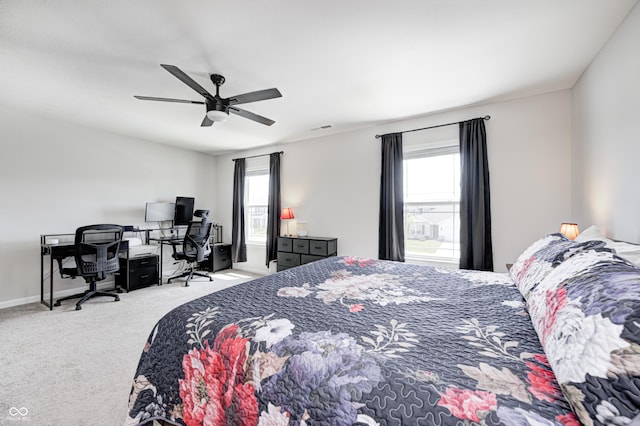 6332 Card Blvd, Indianapolis, IN 46221 - carpeted bedroom featuring multiple windows, a desk, and ceiling fan