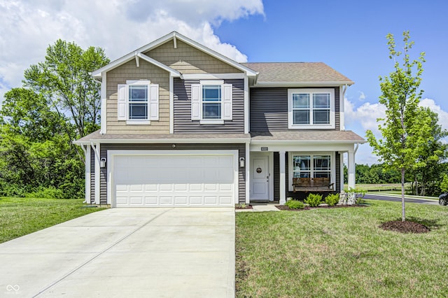 6332 Card Blvd, Indianapolis, IN 46221 - view of front of home featuring a garage, concrete driveway, a front lawn, and a shingled roof