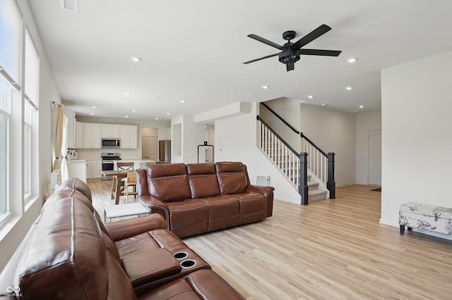 633 Cowley Dr, Westfield, IN 46074 - living area featuring light wood-type flooring, ceiling fan, stairs, and recessed lighting