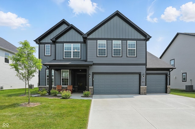 633 Cowley Dr, Westfield, IN 46074 - craftsman inspired home with board and batten siding, driveway, a front yard, a porch, and stone siding