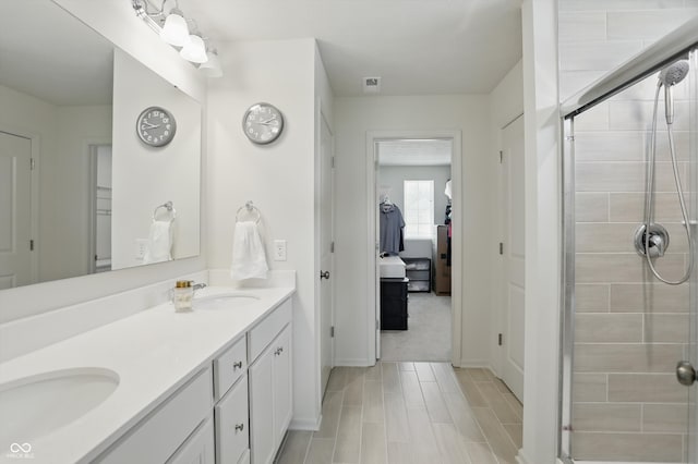633 Cowley Dr, Westfield, IN 46074 - bathroom featuring double vanity, a shower stall, and wood finished floors