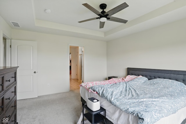 633 Cowley Dr, Westfield, IN 46074 - carpeted bedroom with a tray ceiling and a ceiling fan