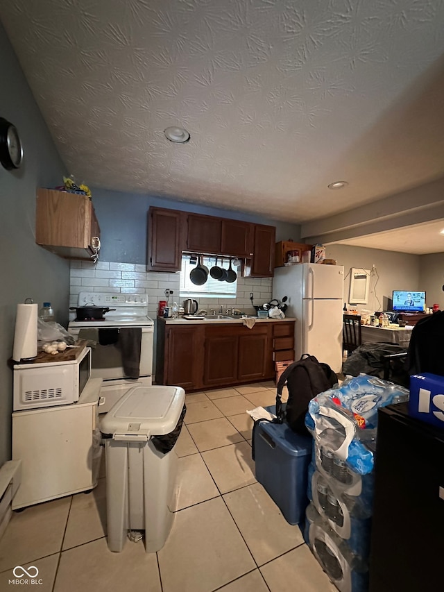 1728 N Somerset Ave, Indianapolis, IN 46222 - kitchen featuring white appliances, decorative backsplash, light tile patterned floors, and recessed lighting