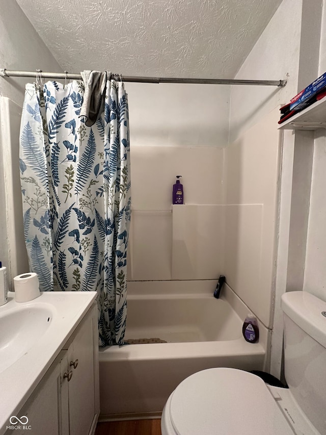 1728 N Somerset Ave, Indianapolis, IN 46222 - full bathroom with a textured ceiling, shower / bathtub combination with curtain, vanity, and wood finished floors