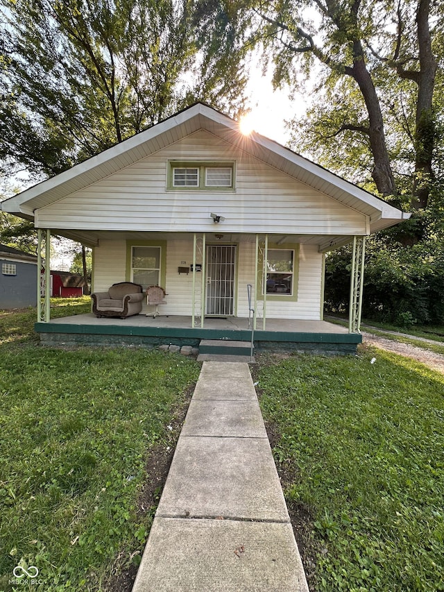 1728 N Somerset Ave, Indianapolis, IN 46222 - bungalow-style house featuring a front yard and a porch