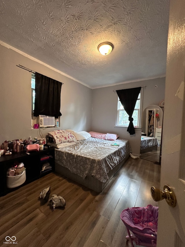 1728 N Somerset Ave, Indianapolis, IN 46222 - bedroom featuring ornamental molding, a textured ceiling, wood finished floors, and cooling unit
