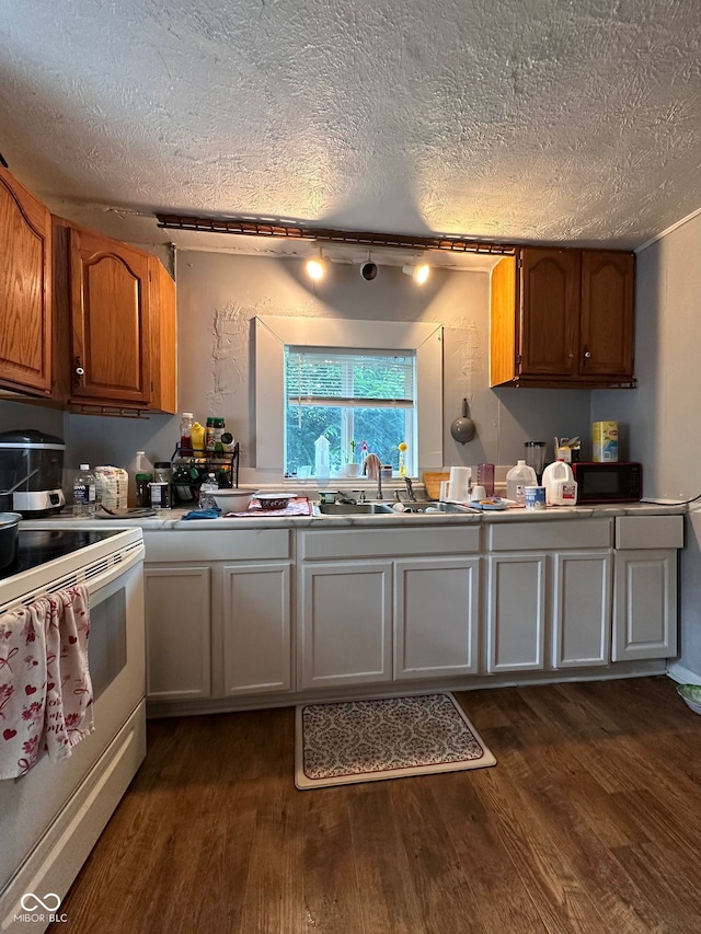 1728 N Somerset Ave, Indianapolis, IN 46222 - kitchen with white electric range oven, dark wood-type flooring, a textured ceiling, black microwave, and brown cabinets