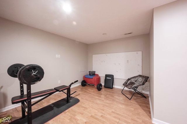 13829 Black Canyon Ct, Fishers, IN 46038 - exercise room with light wood-style floors and baseboards