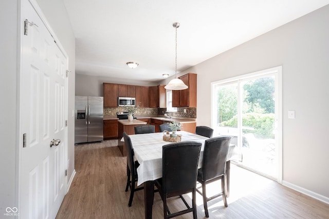 13829 Black Canyon Ct, Fishers, IN 46038 - dining space featuring light wood finished floors and baseboards