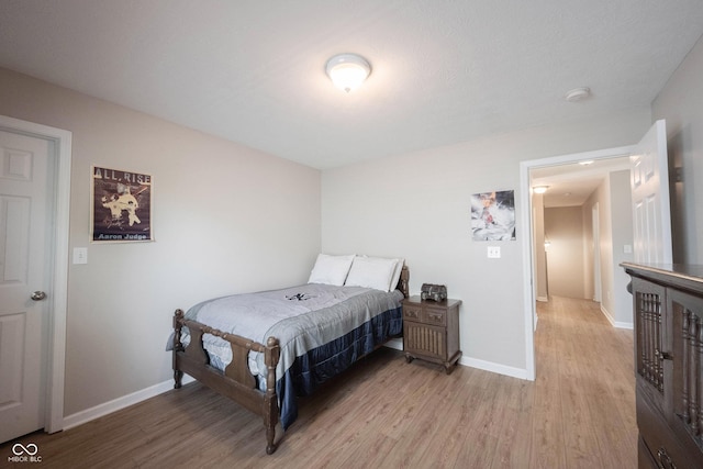 13829 Black Canyon Ct, Fishers, IN 46038 - bedroom with light wood-style floors and baseboards