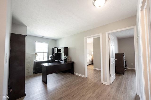 13829 Black Canyon Ct, Fishers, IN 46038 - home office with light wood-type flooring and baseboards