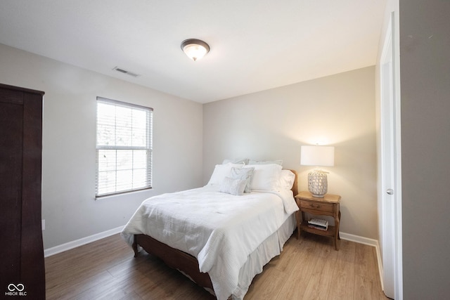 13829 Black Canyon Ct, Fishers, IN 46038 - bedroom with light wood-style flooring and baseboards
