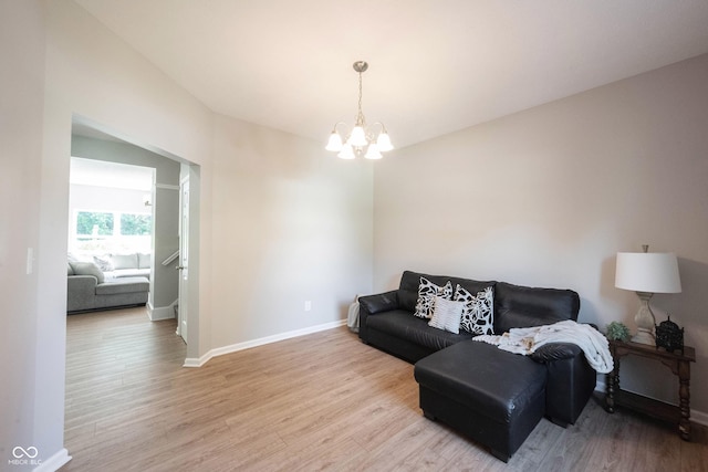 13829 Black Canyon Ct, Fishers, IN 46038 - living room featuring a chandelier and light wood finished floors