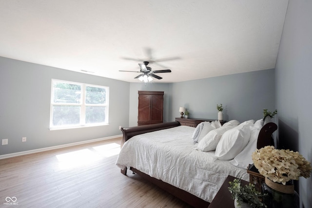 13829 Black Canyon Ct, Fishers, IN 46038 - bedroom with wood finished floors and ceiling fan