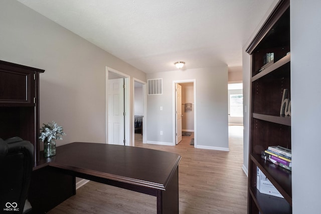 13829 Black Canyon Ct, Fishers, IN 46038 - office area with baseboards and light wood-style floors