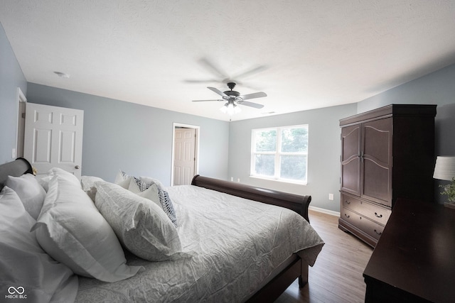 13829 Black Canyon Ct, Fishers, IN 46038 - bedroom with light wood-type flooring and ceiling fan