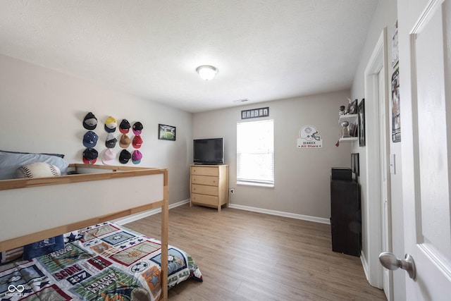 13829 Black Canyon Ct, Fishers, IN 46038 - bedroom featuring light wood-type flooring and baseboards