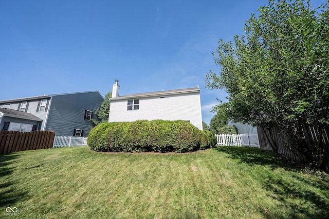 13829 Black Canyon Ct, Fishers, IN 46038 - rear view of property featuring a fenced backyard and a chimney
