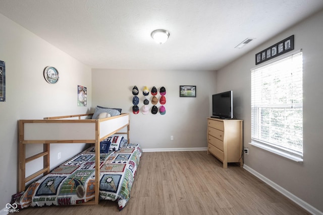 13829 Black Canyon Ct, Fishers, IN 46038 - bedroom with light wood-type flooring and baseboards
