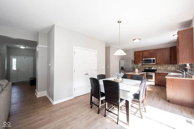 13829 Black Canyon Ct, Fishers, IN 46038 - dining room with light wood finished floors